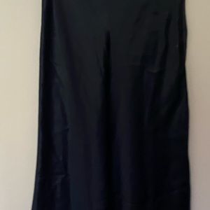 Black satin skirt below the Knee size small with soot on side